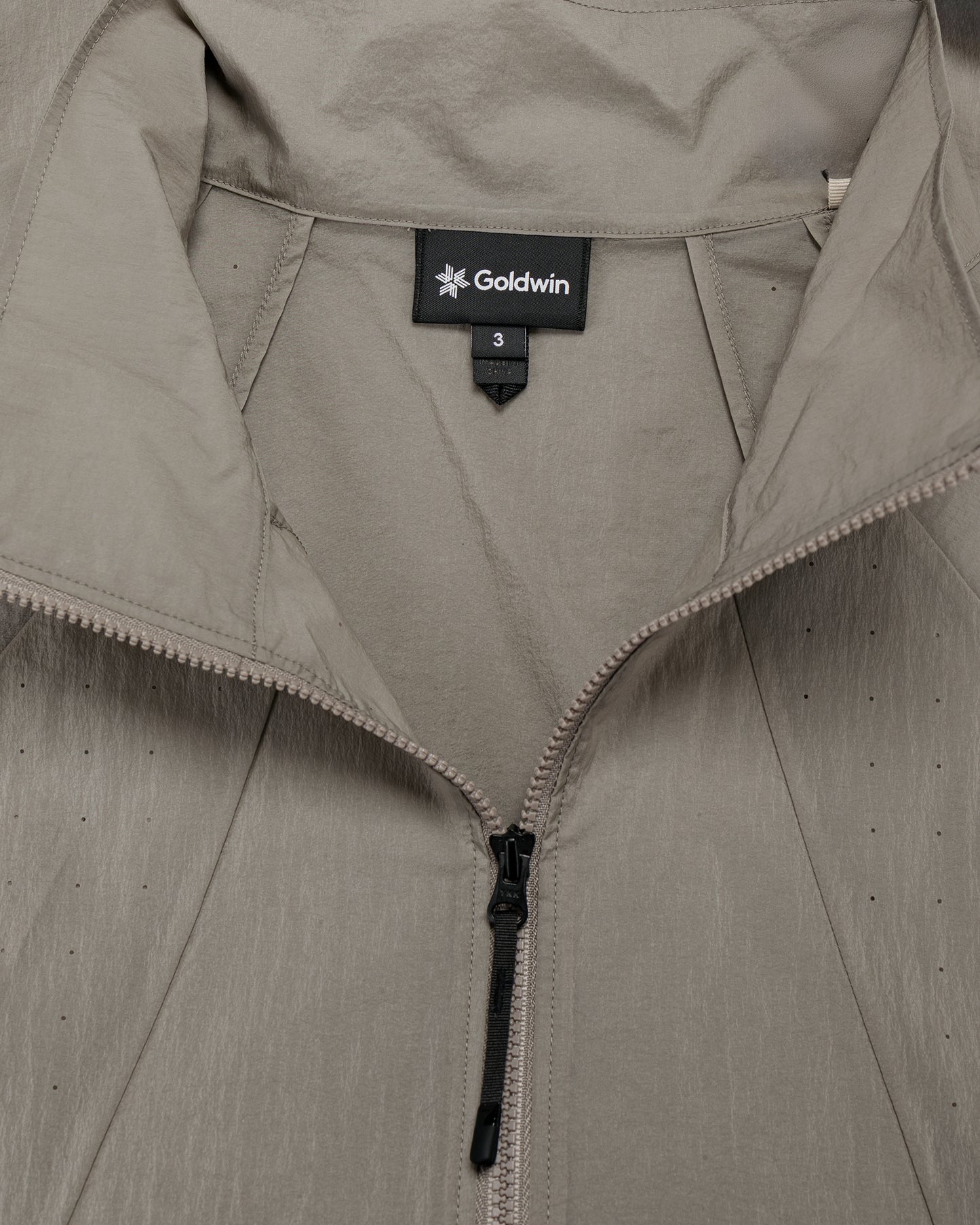 lost & found Goldwin Goldwin Sheer Nylon Wind Jacket Arid Beige
